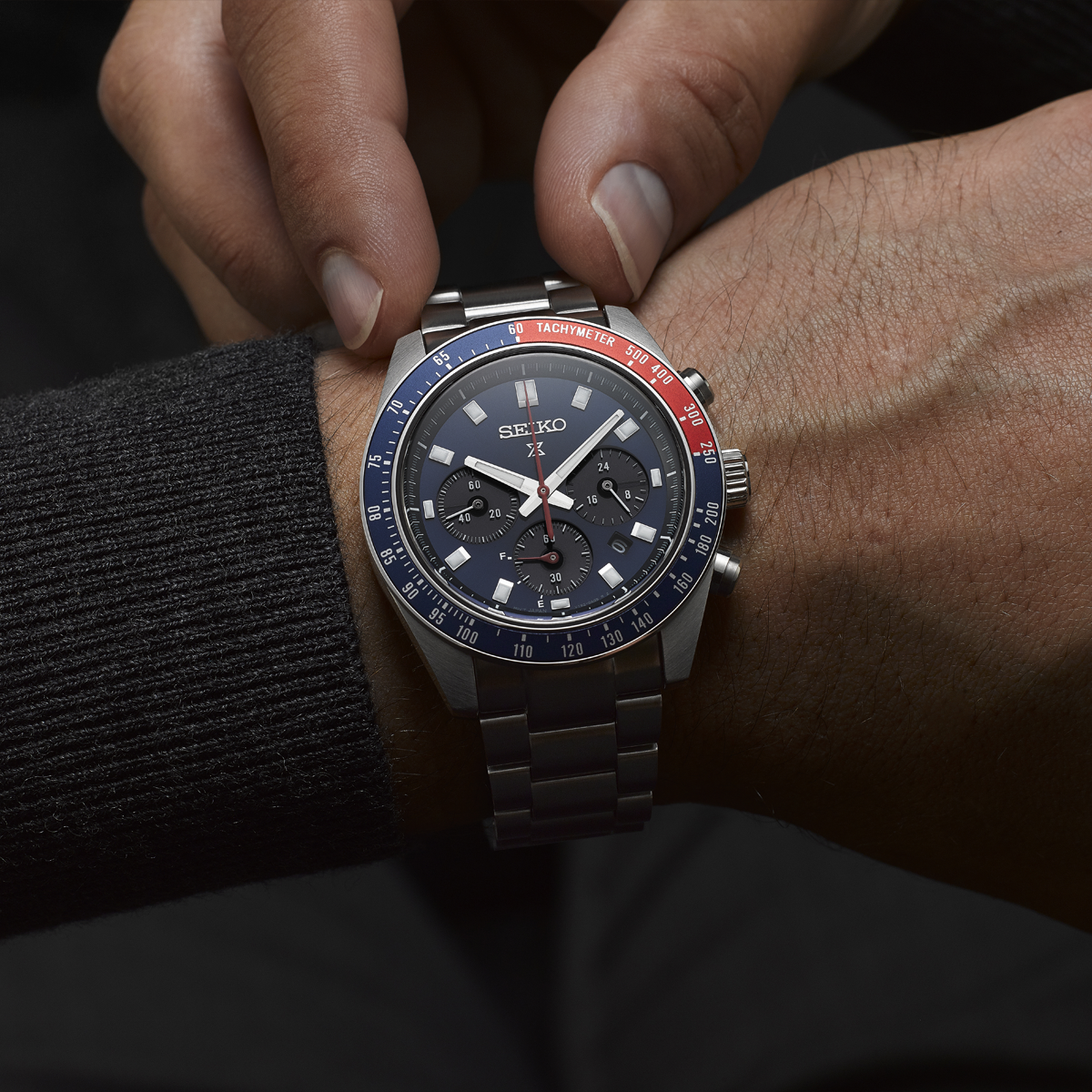 Model wears Seiko Prospex Speedtimer “Go Large” Solar Chronograph, Blue Dial With Stainless Steel Bracelet - SSC913P1