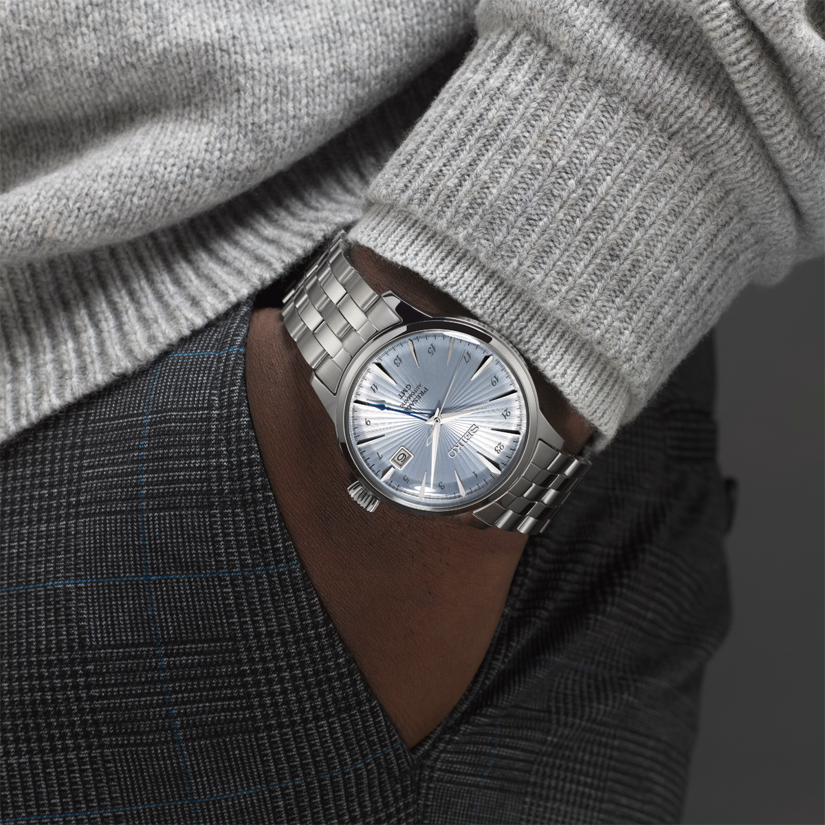 Model wears Seiko Presage ‘Skydiving' Cocktail Time GMT, Blue Dial with Stainless Steel Bracelet - SSK037J1