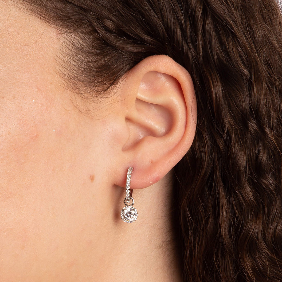 Model wears Sterling Silver Round Cubic Zirconia With Pave Detail Hoop Earrings