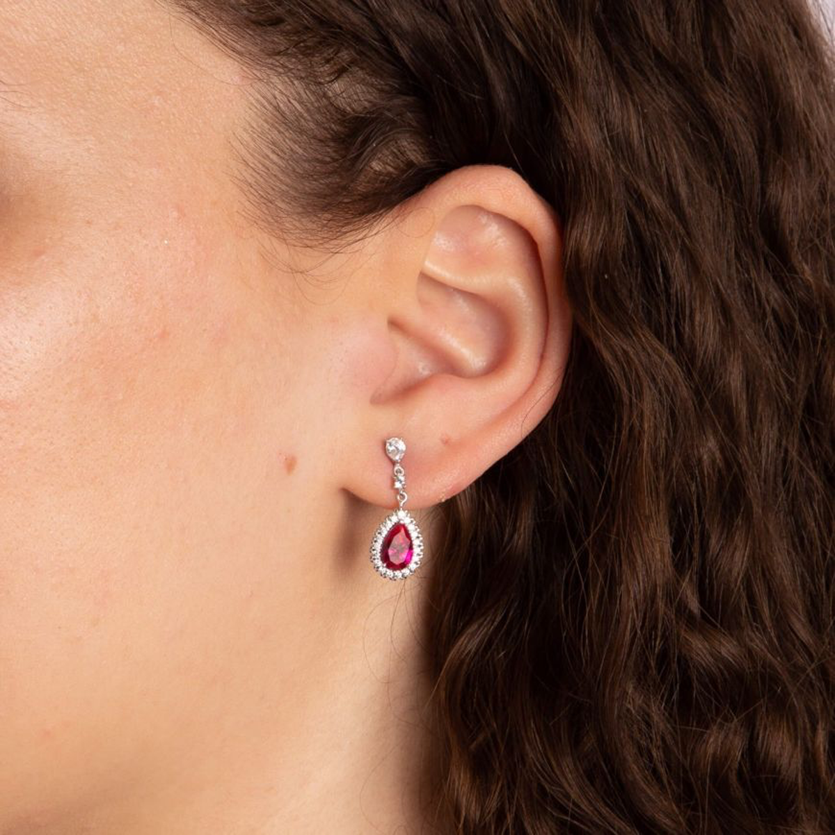 Models wears Sterling Silver Teardrop Red Cubic Zirconia With Pave Surround Drop Earrings