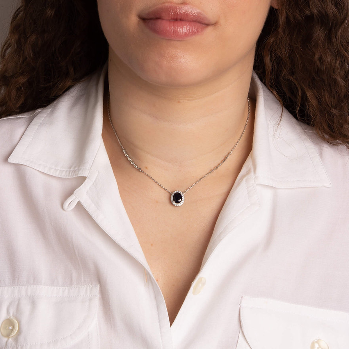 Model wears Sterling Silver Oval Shaped Blue Cubic Zirconia Cluster Necklace