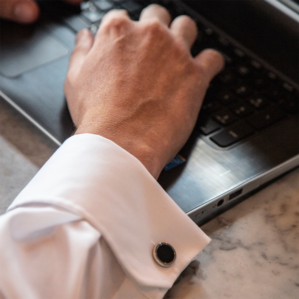 Model wears Stainless Steel Round Black Onyx Cufflinks