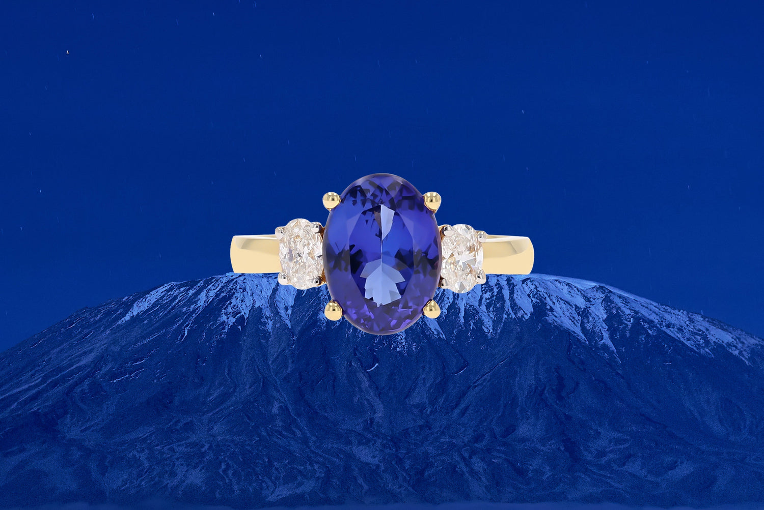 18ct White Gold Oval Shaped Tanzanite & Diamond Trilogy Ring