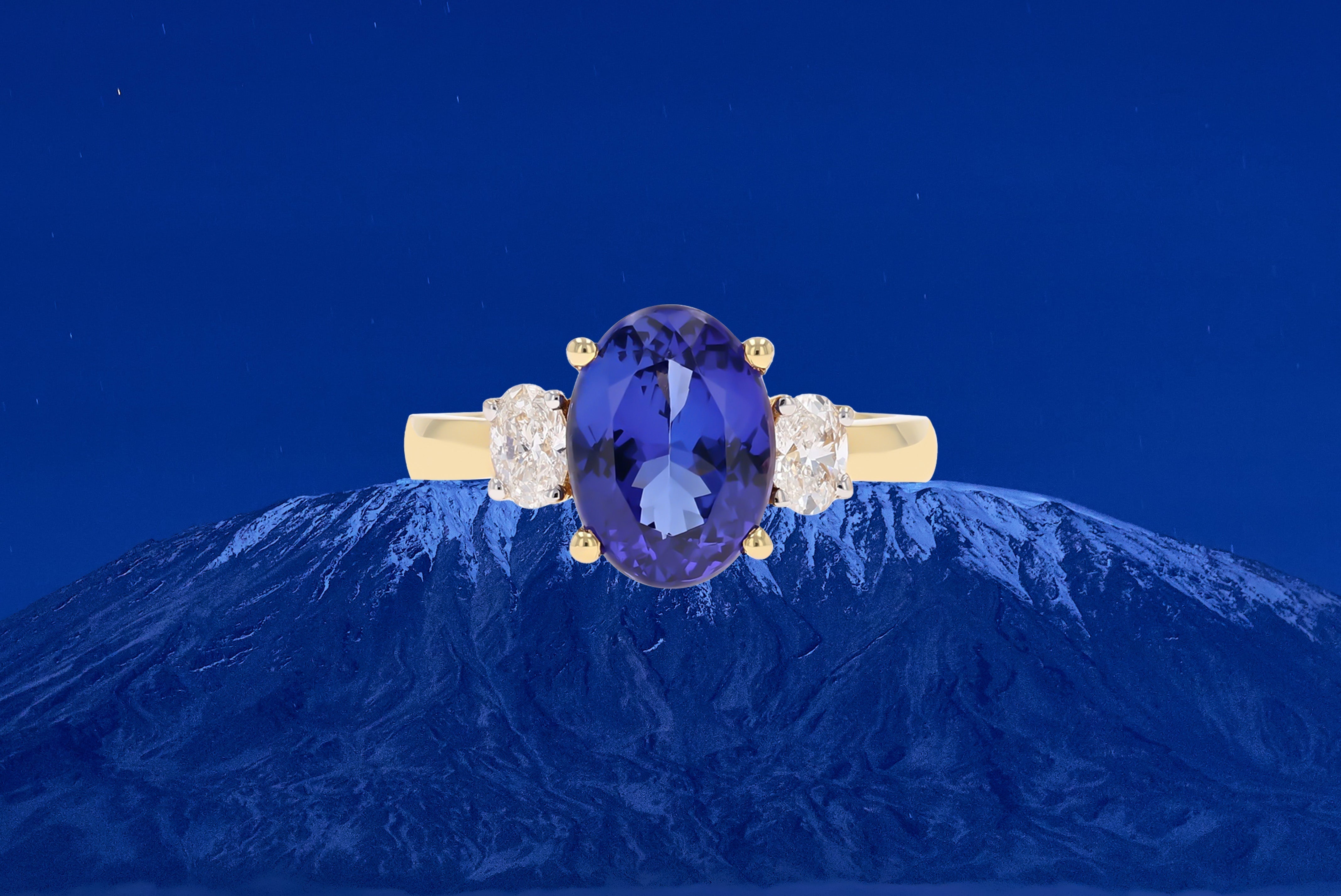 18ct White Gold Oval Shaped Tanzanite & Diamond Trilogy Ring