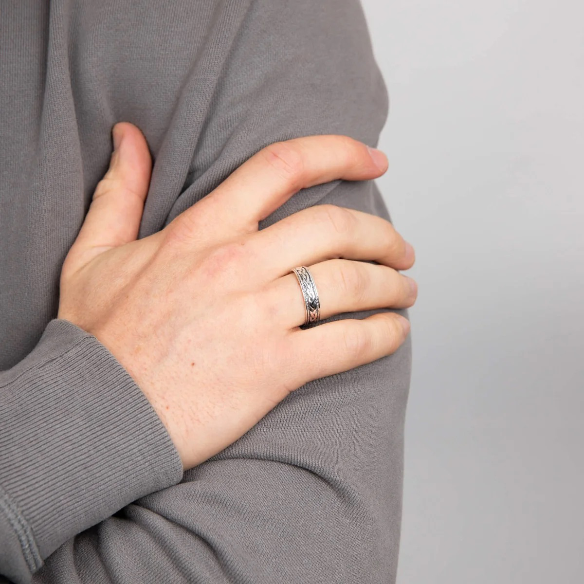Model wears Sterling Silver Plaited Design Band Ring