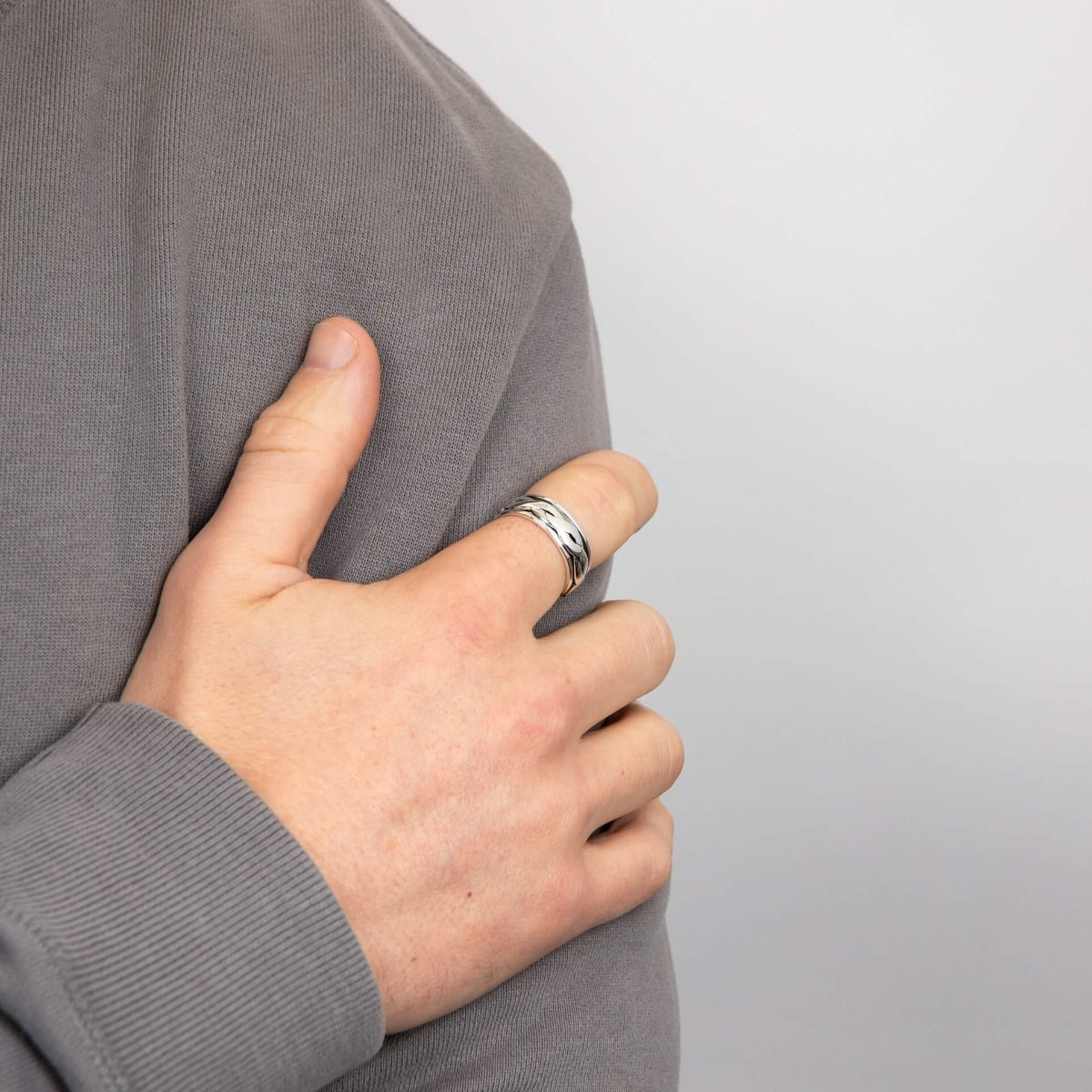Model wears Sterling Silver Motion Celtic Ring