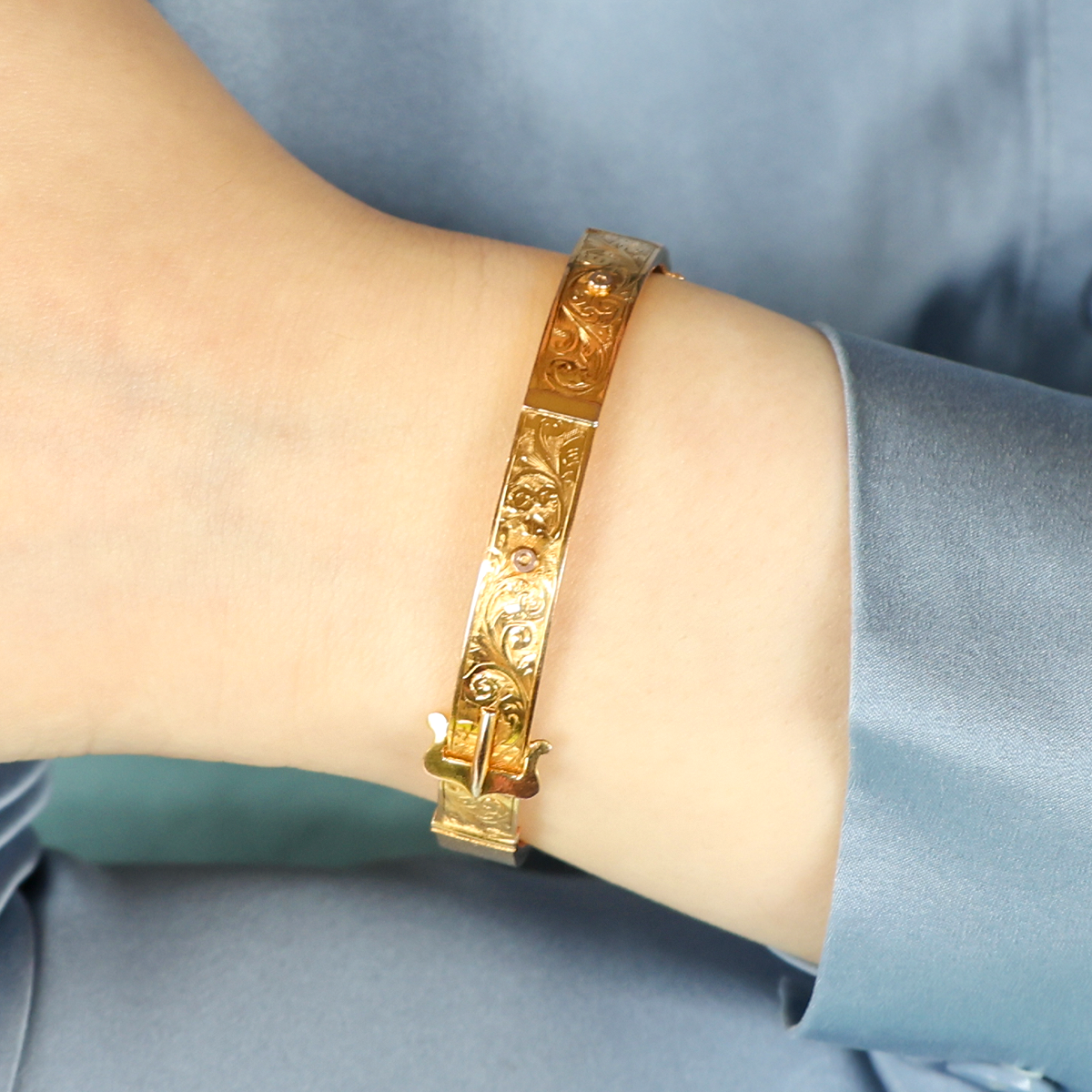 Model wears 9ct Yellow Gold Hollow Engraved Buckle Hinged Bangle