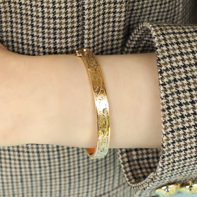 Model wears 9ct Yellow Gold Hollow Engraved Hinged Bangle