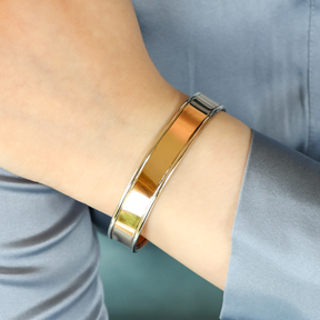 Model wears 9ct Yellow & White Gold Plain Flat Cuff Bangle