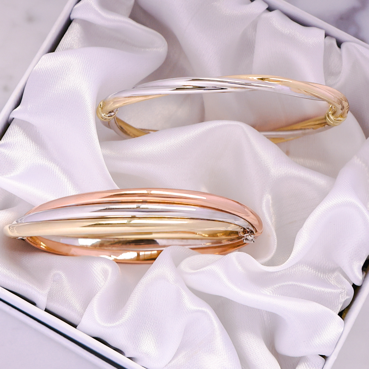 9ct Two Colour Gold Plain Twisted Tension Bangle & 9ct Three Colour Gold Entwined Hinged Bangle