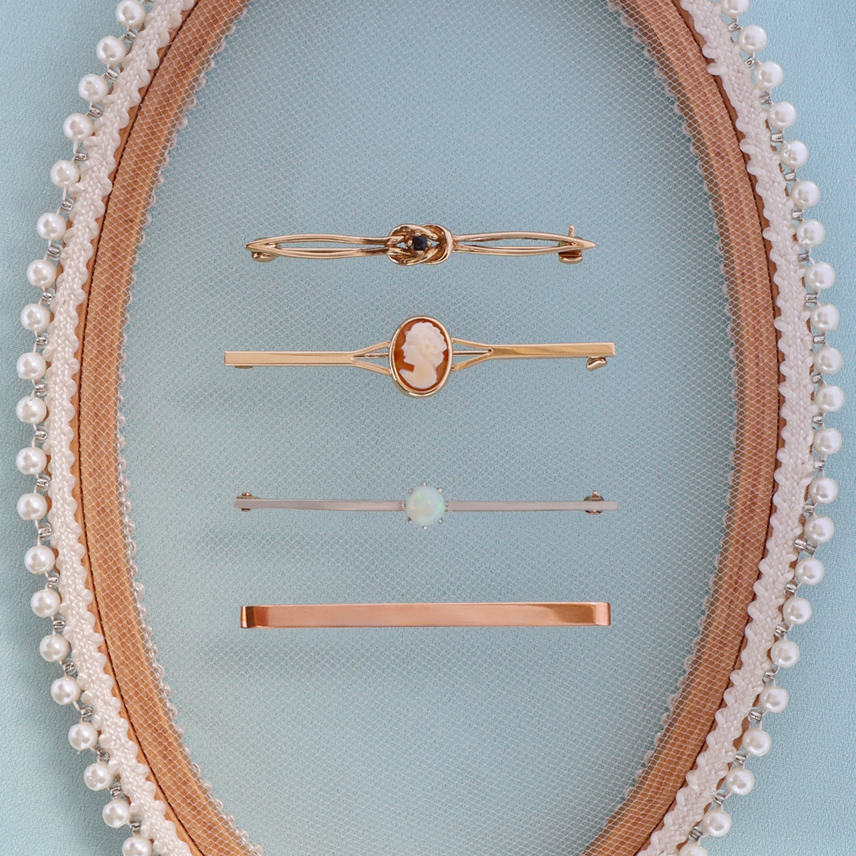 9ct Yellow Gold Sapphire Love Knot Brooch, 9ct Yellow Gold Oval Shaped Cameo Bar Brooch, 9ct Yellow & White Gold Opal Solitaire Bar Brooch & 9ct Rose Gold Plain Polished Bar Brooch