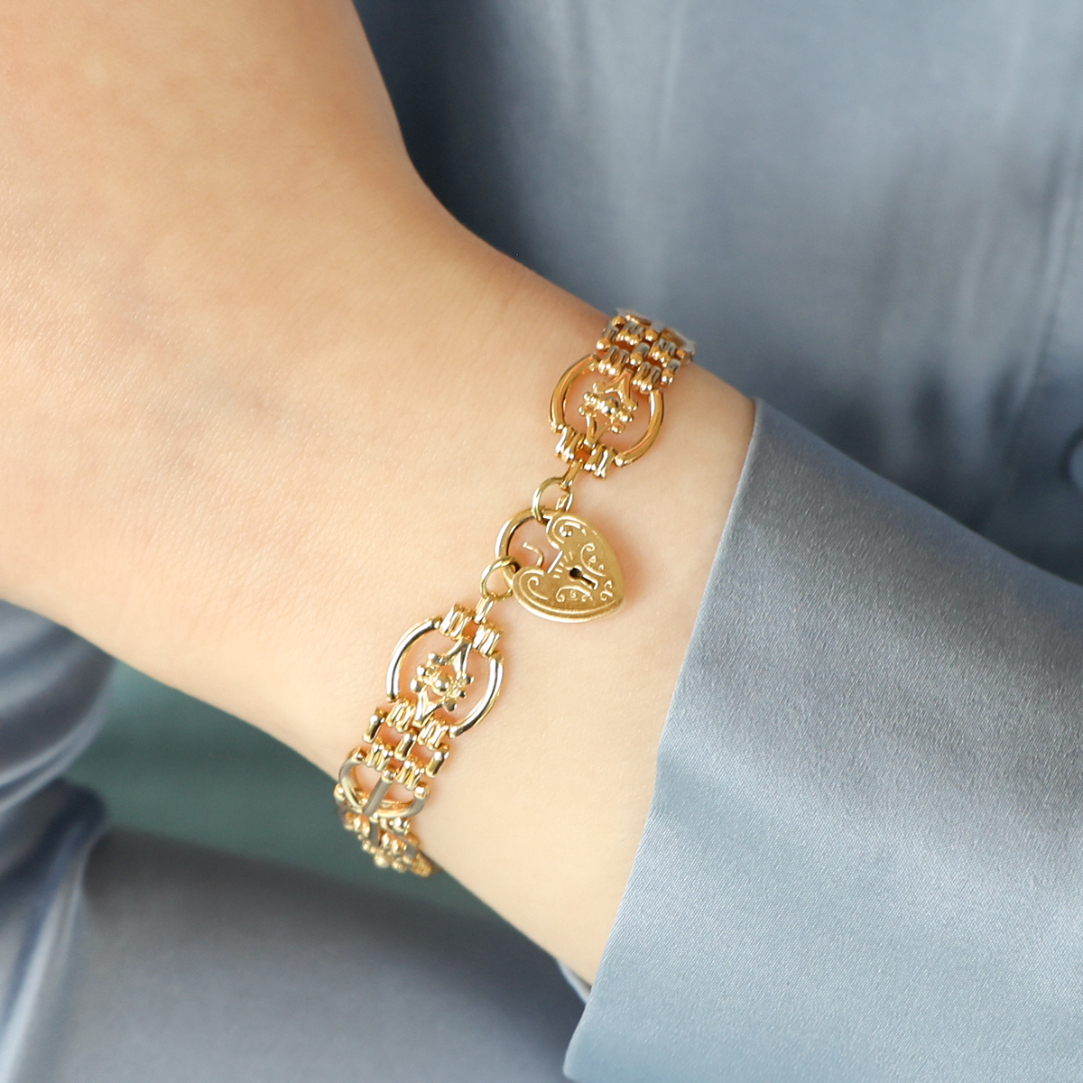 Model wears 14ct Yellow Gold 7.5" Evil Eye Gate Bracelet