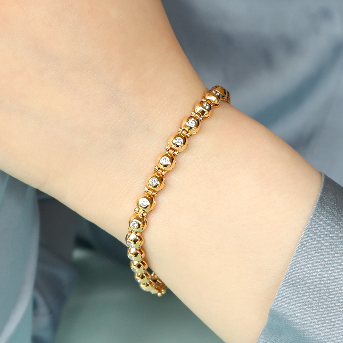 Model wears 18ct Yellow Gold Diamond Set Bubble Tennis Bracelet