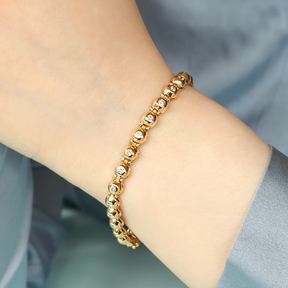 Model wears 18ct Yellow Gold Diamond Set Bubble Tennis Bracelet