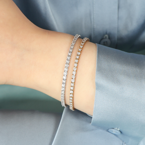 Model wears 9ct White Gold 1.00ct Diamond Tennis Illusion Set Bracelet & 9ct Yellow Gold 1.00ct Diamond Tennis Illusion Set Bracelet