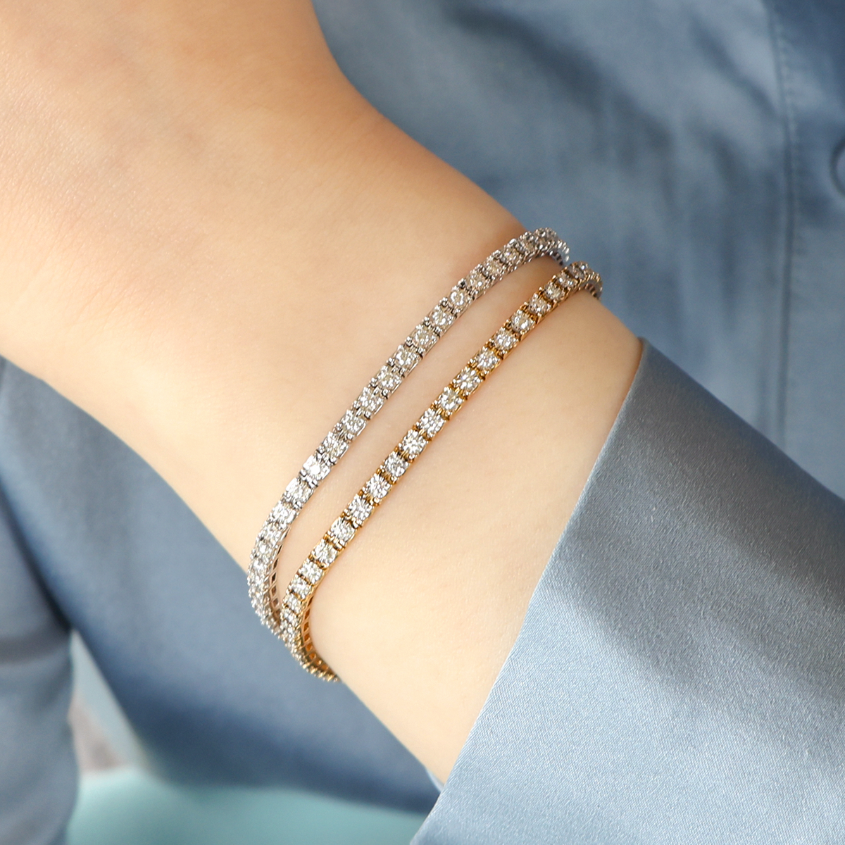 Model wears 9ct White Gold 1.00ct Diamond Tennis Illusion Set Bracelet & 9ct Yellow Gold 1.00ct Diamond Tennis Illusion Set Bracelet