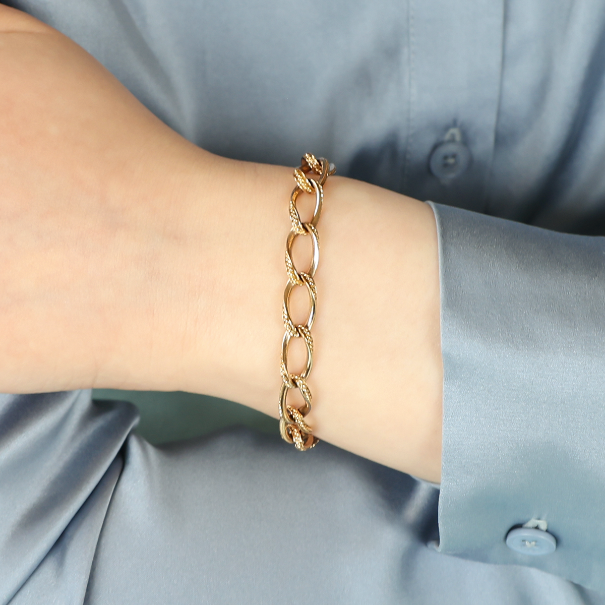 Model wears 9ct Yellow Gold Twisted Rope Edge Charm Bracelet