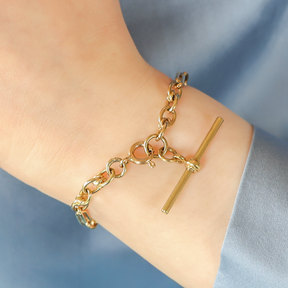 Model wears 9ct Yellow Gold Double Fetter & Love Knot T-Bar Bracelet