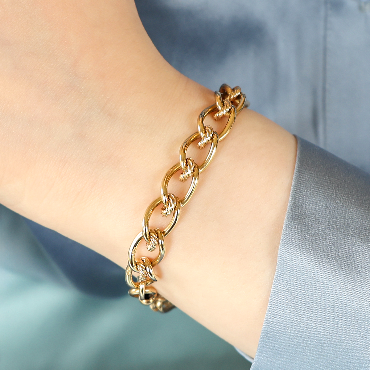 Model wears 9ct Yellow Gold Elongated Curb & Cable Fancy Link Bracelet