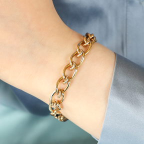 Model wears 9ct Yellow Gold Elongated Curb & Cable Fancy Link Bracelet