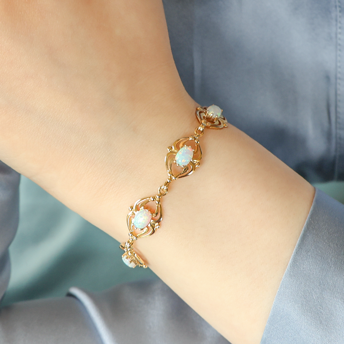 Model wears 9ct Yellow Gold "Synthetic" Opal Openwork Bracelet