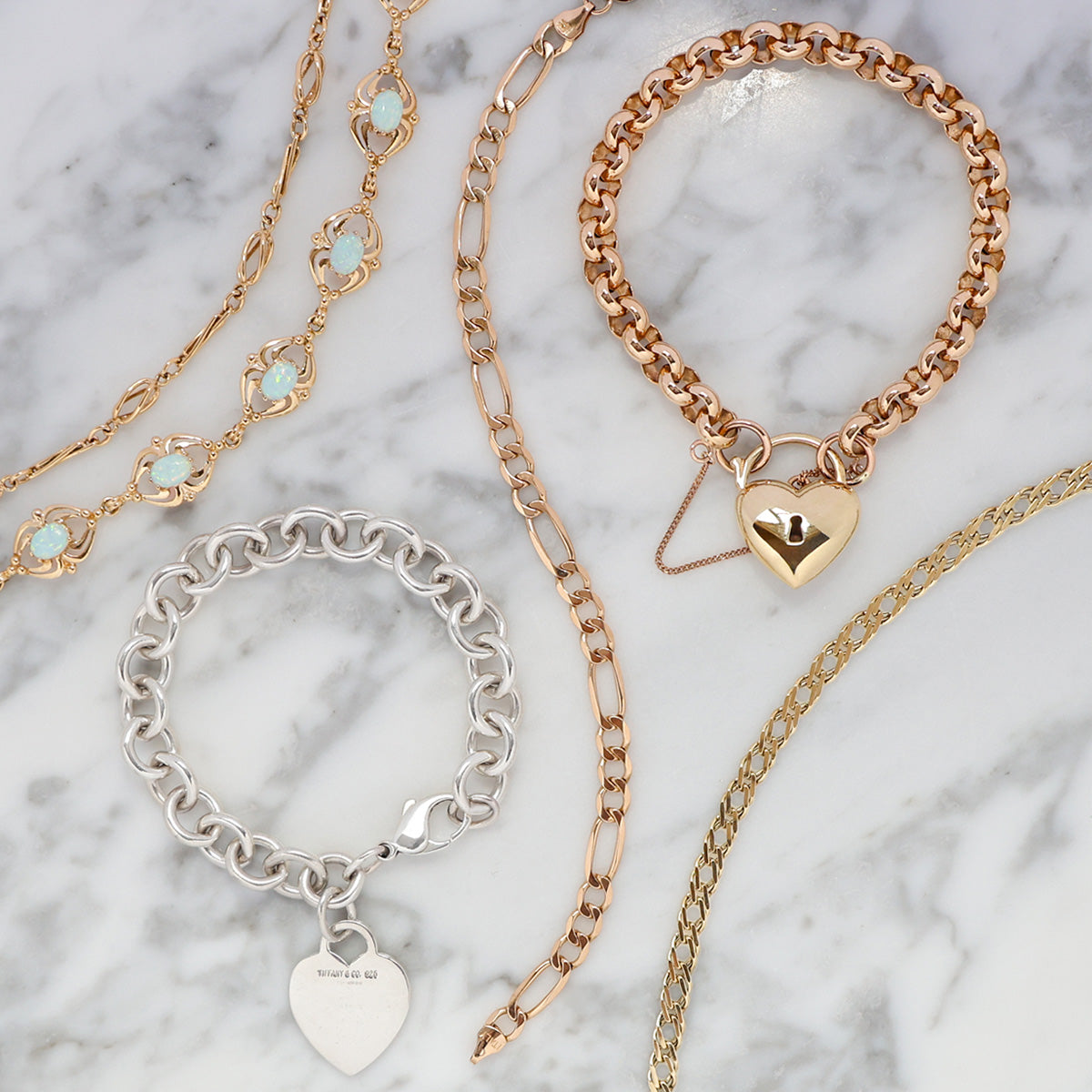 A selection of 9ct gold and sterling silver bracelets.