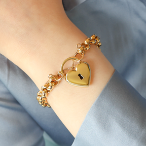 Model wears 9ct Yellow Gold Hollow Belcher with Puffed Heart Shaped Padlock Bracelet