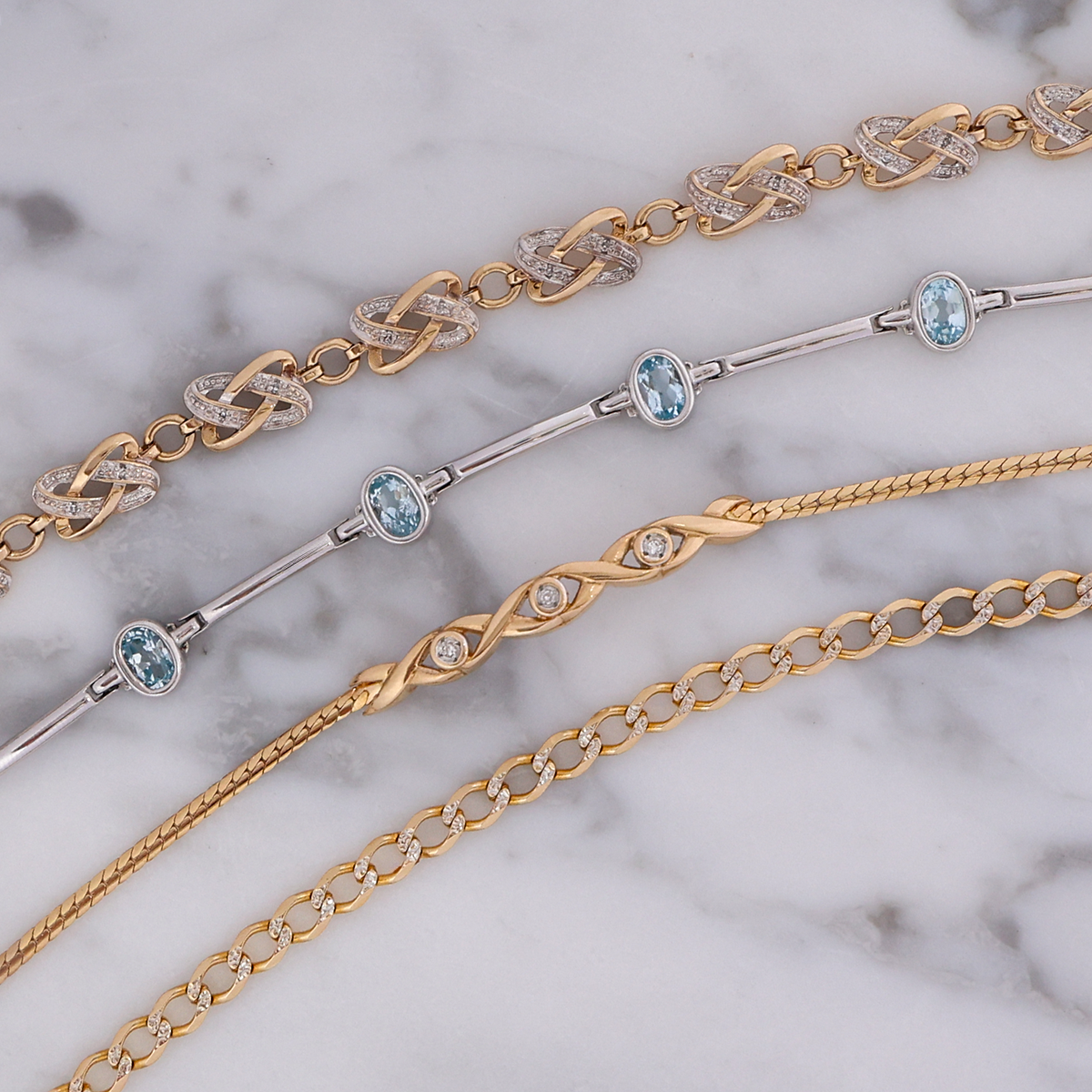 9ct Yellow Gold Knot Diamond Bracelet, 9ct White Gold Oval Shaped Bezel Set Blue Topaz Bar Bracelet, 9ct Yellow Gold Diamond Twist Bar Herringbone Bracelet and 9ct Yellow & White Gold Diamond Cut Curb Bracelet 