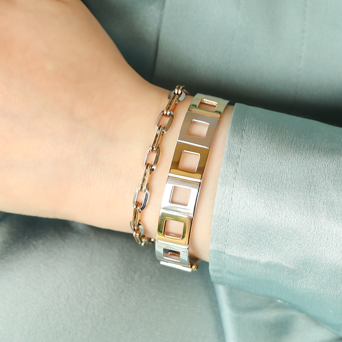 Model wears 9ct Yellow & White Gold Double Anchor & Bevelled Oval Link Bracelet & 9ct Yellow & White Gold Square Link Hinged Bangle