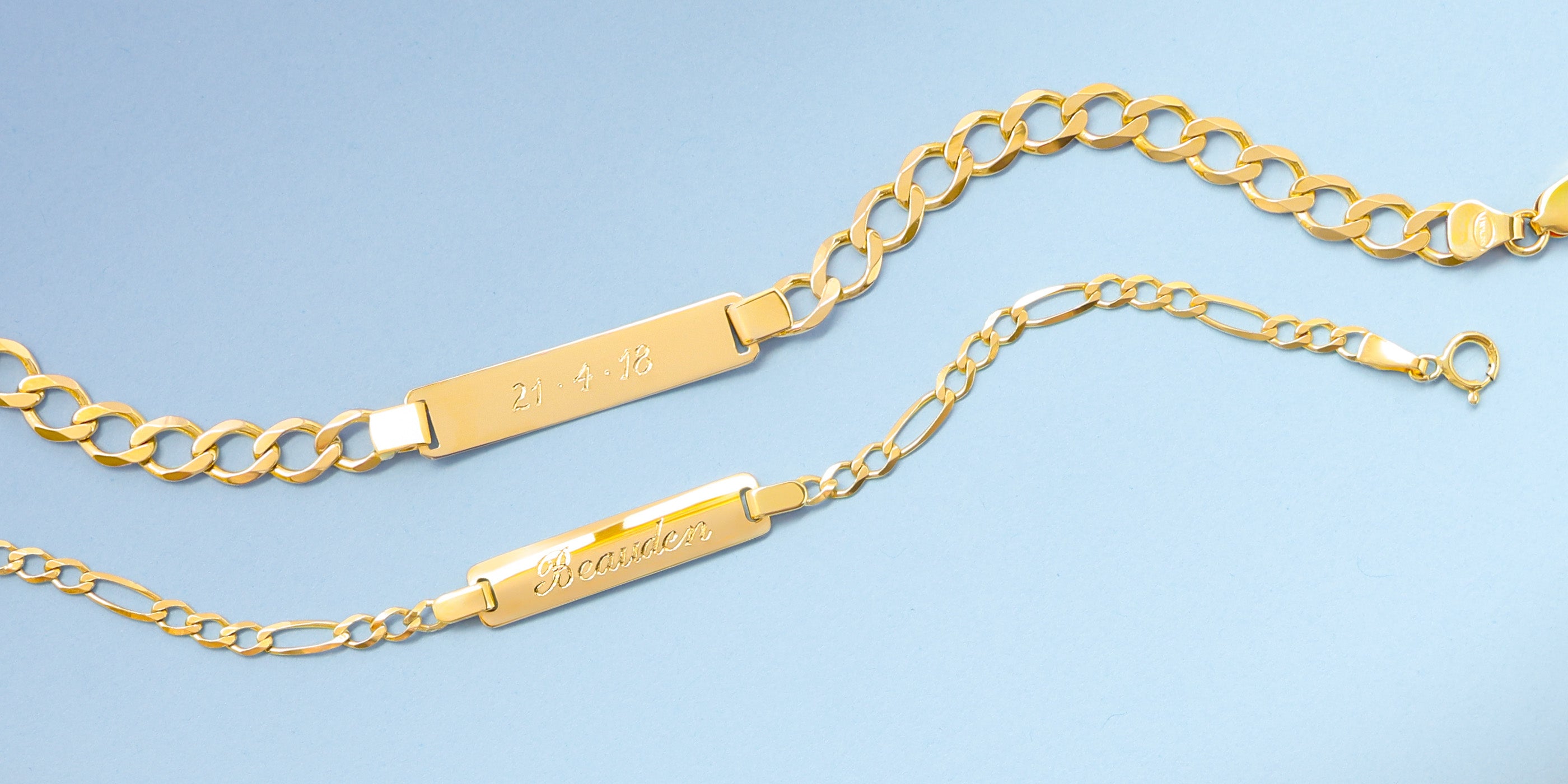9ct yellow gold children's I.D curb and figaro link bracelets personalised with hand-engraved names and date.