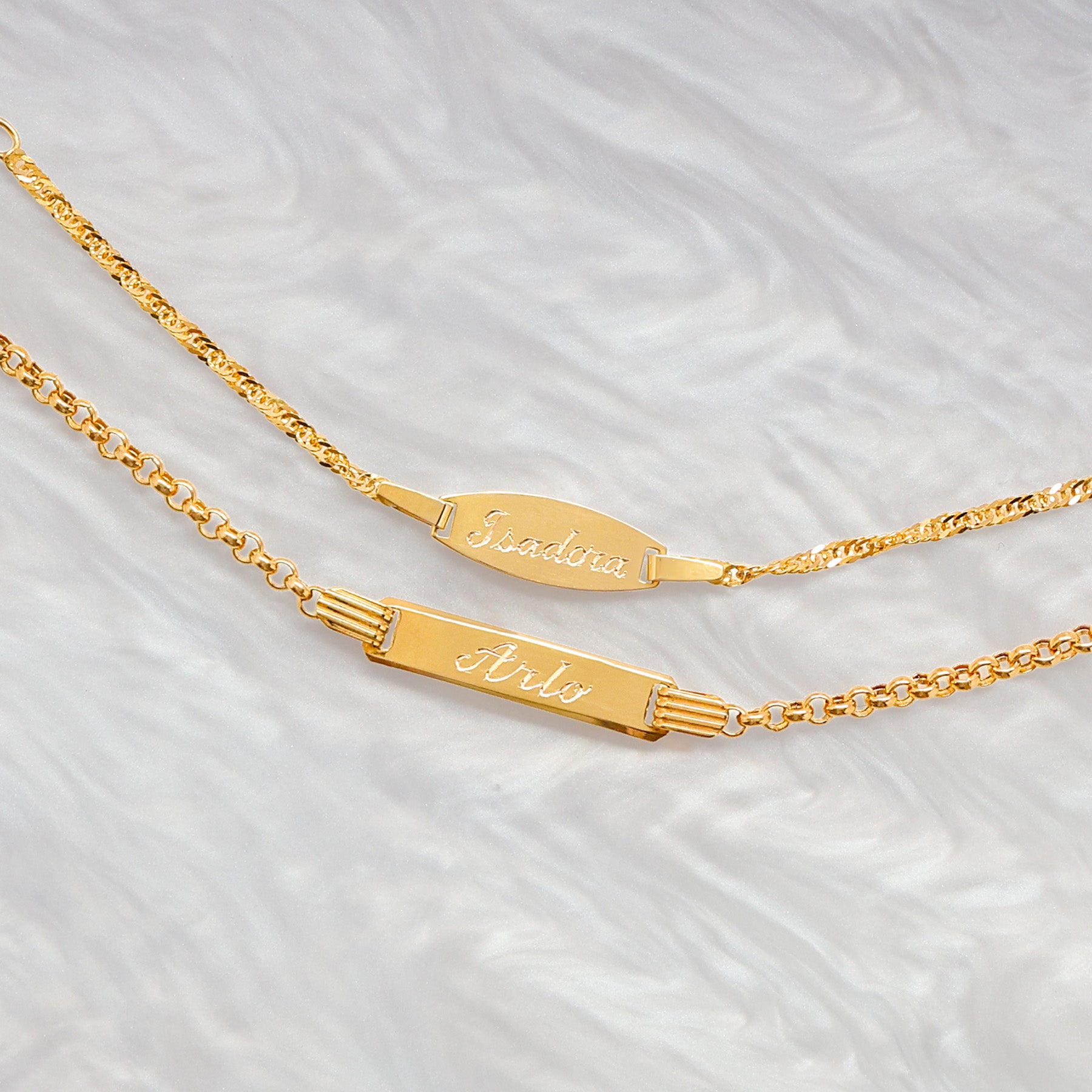9ct yellow gold children's I.D bracelets personalised with hand-engraved names.    