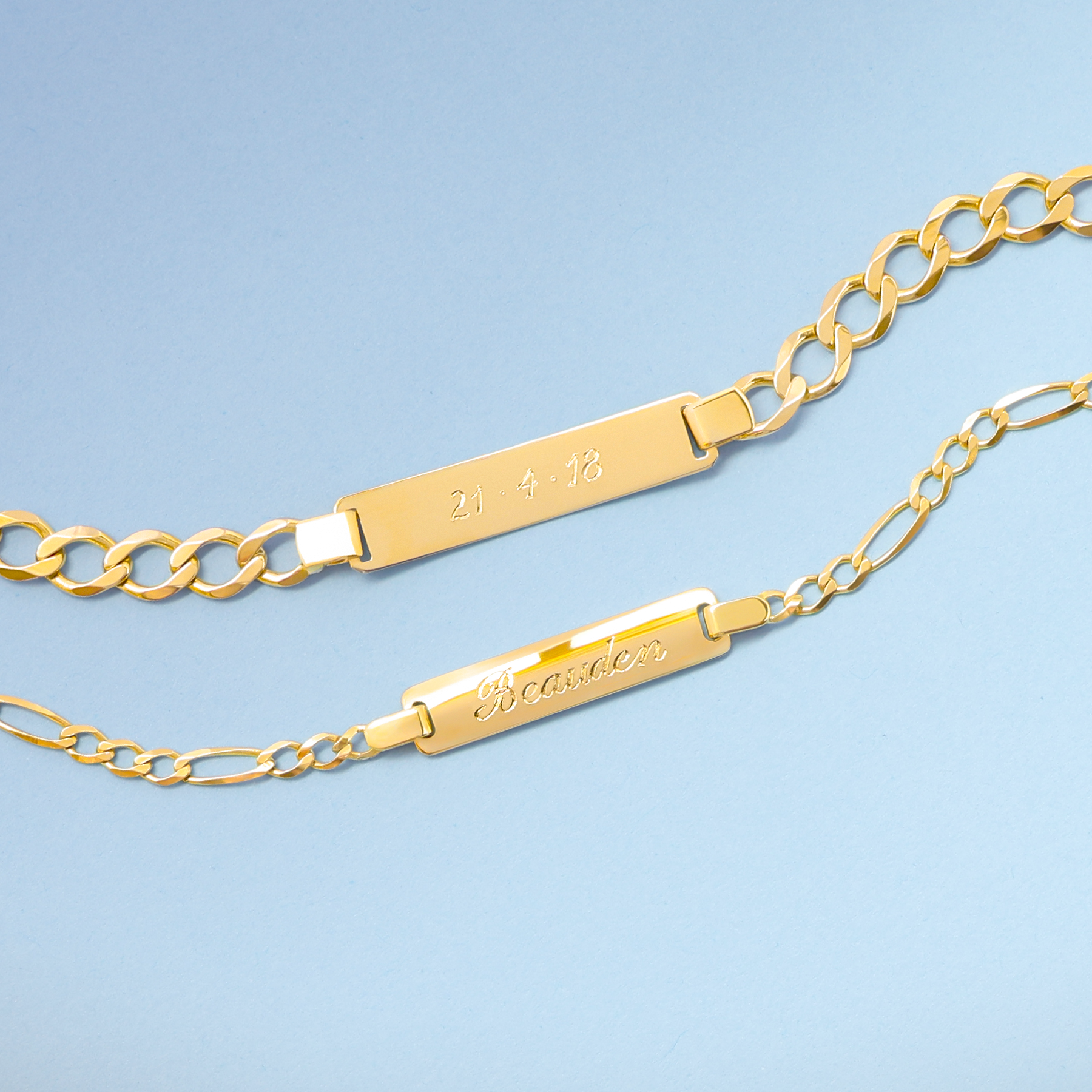 9ct yellow gold children's I.D curb and figaro link bracelets personalised with hand-engraved names and date.