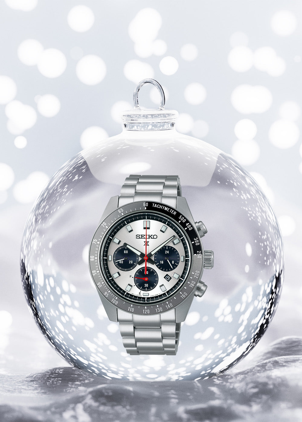 Seiko Prospex Speedtimer “Go Large” Solar Chronograph, White Dial with Stainless Steel Bracelet in Bauble on Snow Background