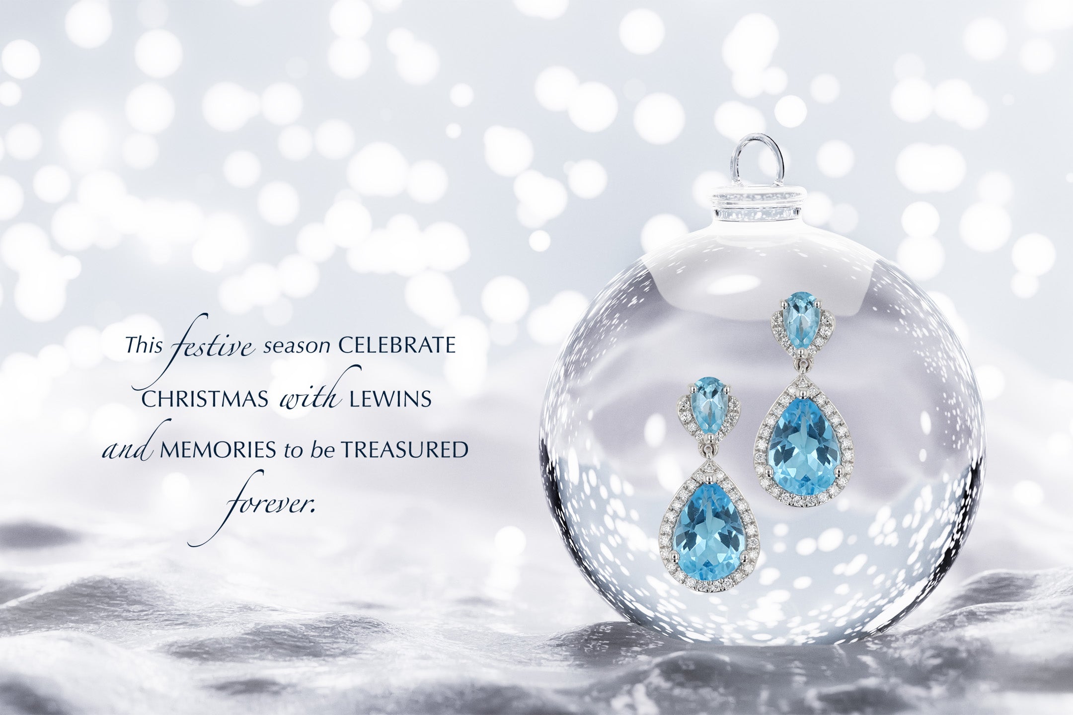 9ct White Gold Blue Topaz & Diamond Halo Drop Earrings in Bauble on Snow Background