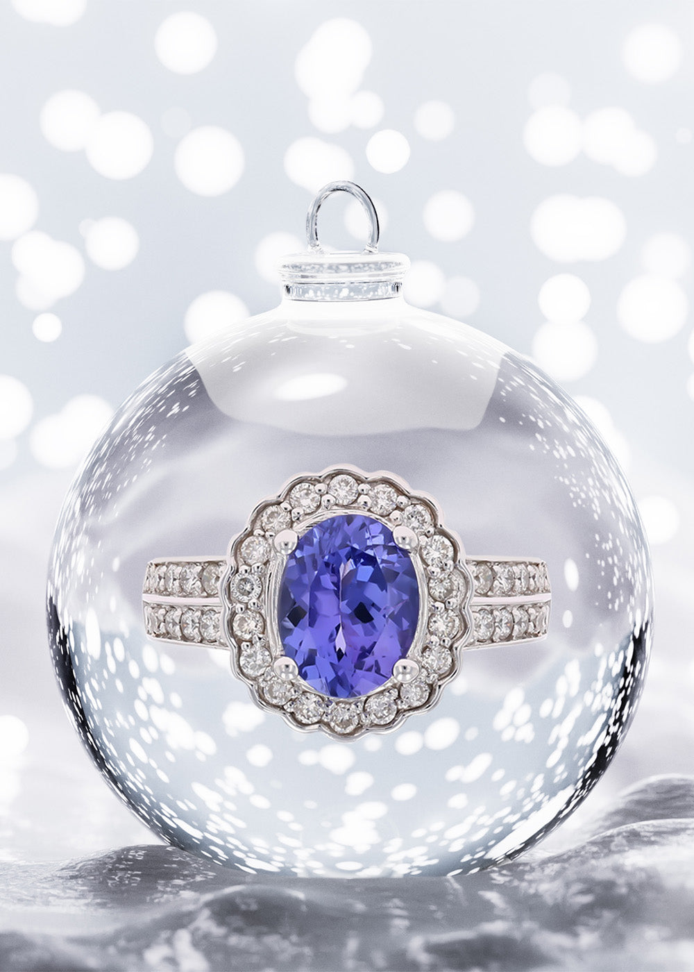 14ct White Gold Oval Tanzanite & Diamond Cluster Ring in Bauble on Snow Background