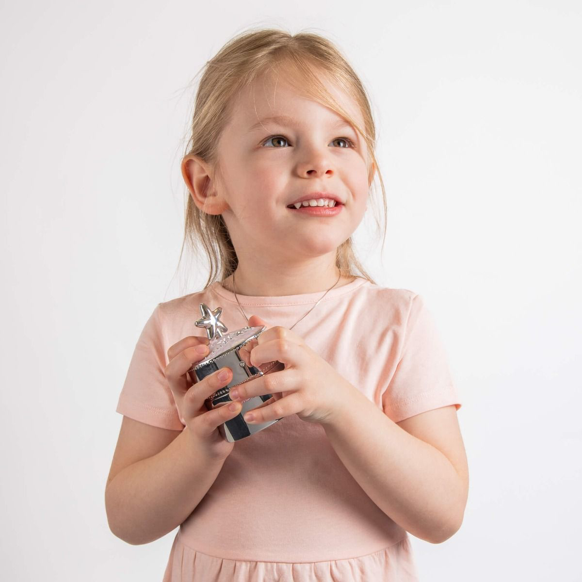 Model holds Silver Plated Pink Star Music Trinket Box with Crystal