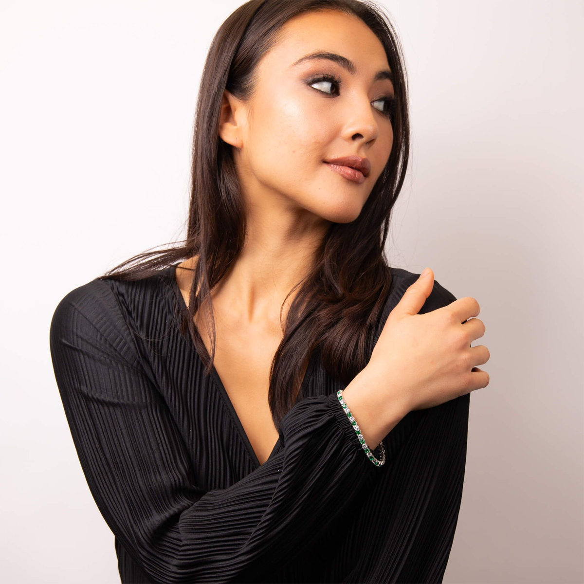 Model wears Sterling Silver Green Cubic Zirconia Tennis Bracelet