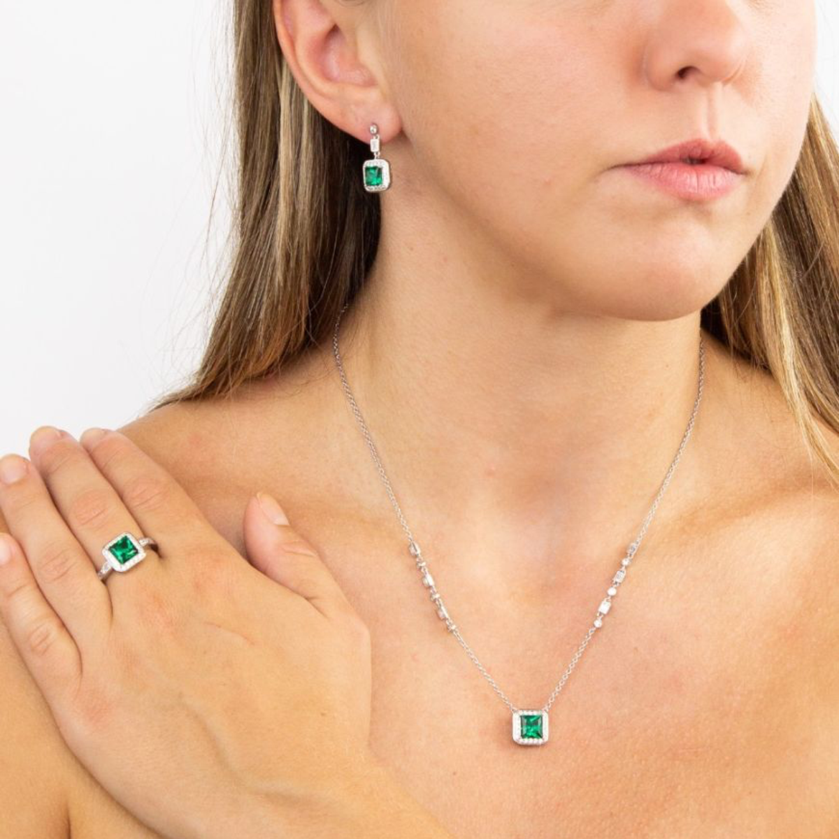 Model wears Sterling Silver Art Deco Stye Green Cubic Zirconia Pave Set Ring, Earrings & Necklace