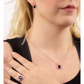 Model wears Sterling Silver Oval Blue Cubic Zirconia Trilogy Ring