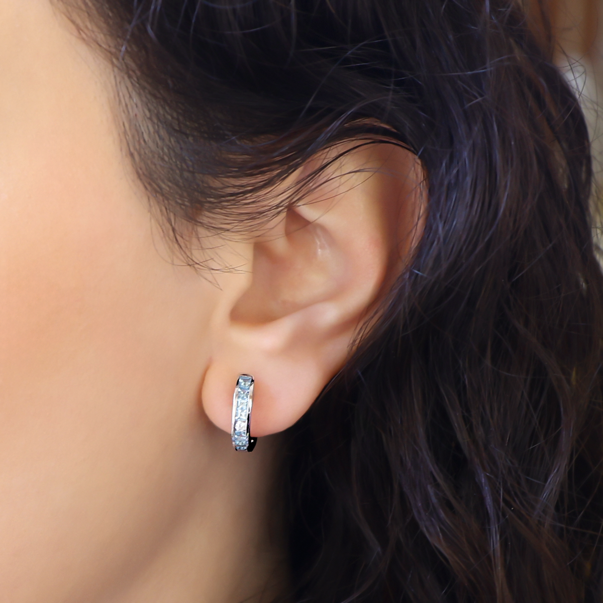 Model wears 18ct White Gold Aquamarine & Diamond Half Set Hoop Earrings