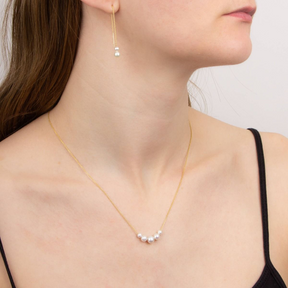 Model wears 9ct Yellow Gold Freshwater Pearl Pull Through Earrings & Necklace