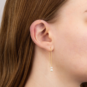 Model wears 9ct Yellow Gold Freshwater Pearl Pull Through Earrings
