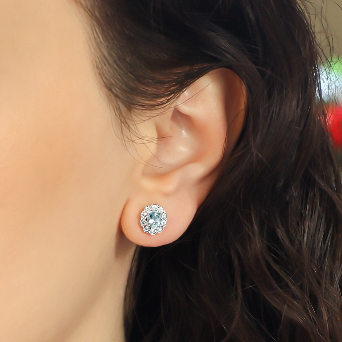 Model wears 18ct White Gold Aquamarine & Diamond Oval Cluster Stud Earrings