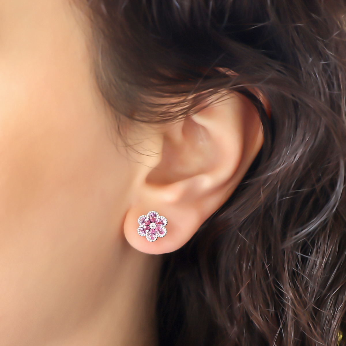 Model wears 18ct White Gold Pink Sapphire & Diamond Flower Stud Earrings