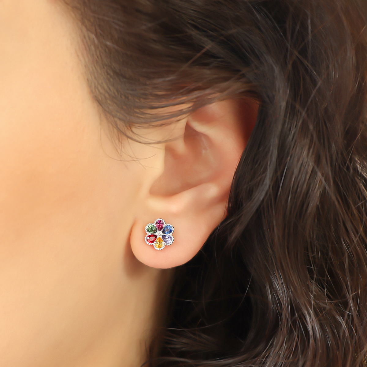 Model wears 18ct White Gold Fancy Sapphire & Diamond Flower Stud Earrings