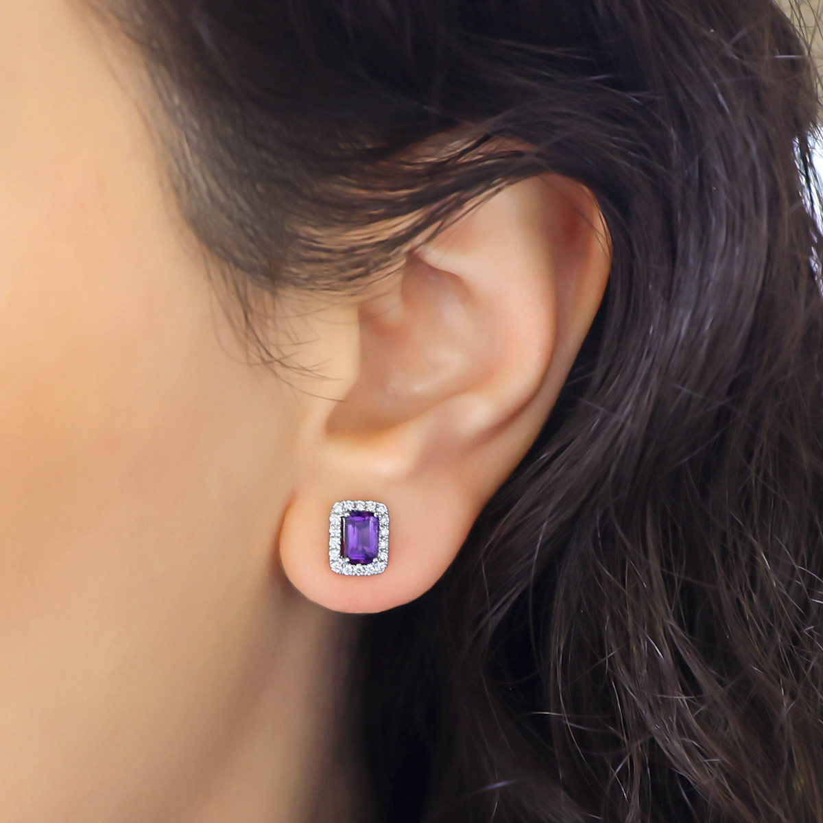Model wears 18ct White Gold Octagonal Amethyst & Diamond Halo Stud Earrings