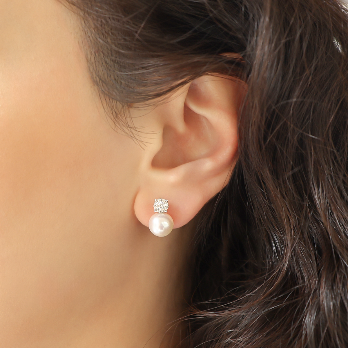 Model wears 9ct White Gold Cultured Freshwater Pearl & Diamond Stud Earrings