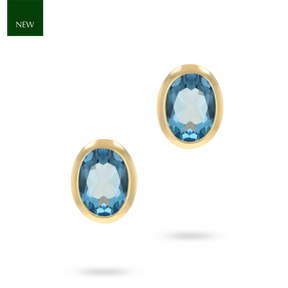 9ct Yellow Gold Oval Shaped Blue Topaz Bezel Set Stud Earrings