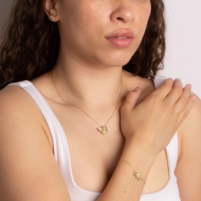 Model wears 9ct Yellow Gold Bee Stud Earrings, Bracelet and Pendant