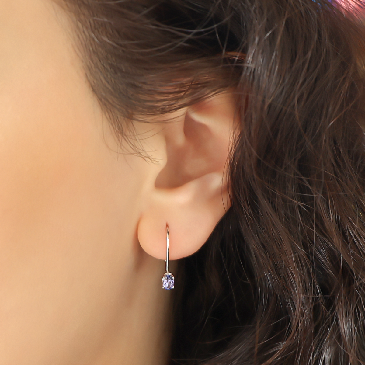 Model wears 14ct White Gold Tanzanite Set Drop Earrings